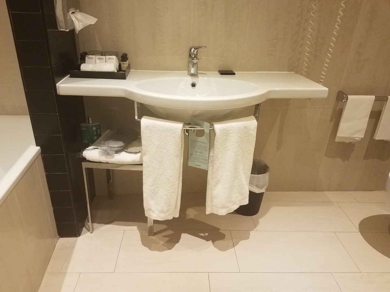 a sink with towels from it