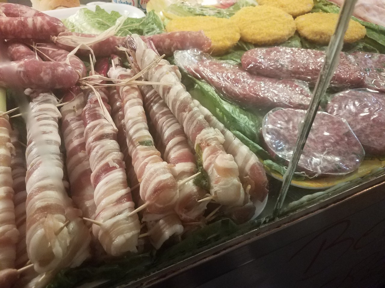meat wrapped in bacon on a tray