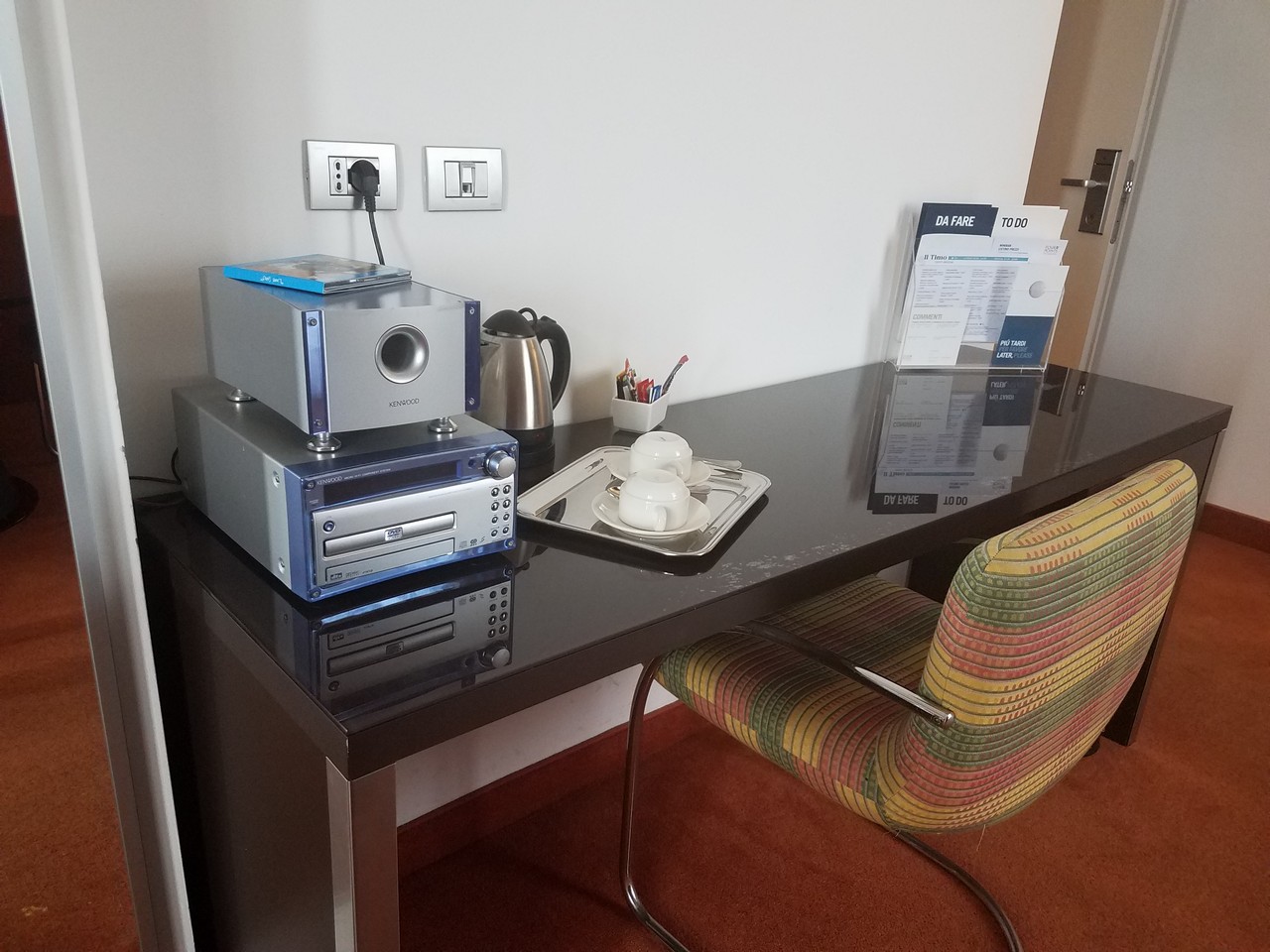 a table with a speaker and a tray on it