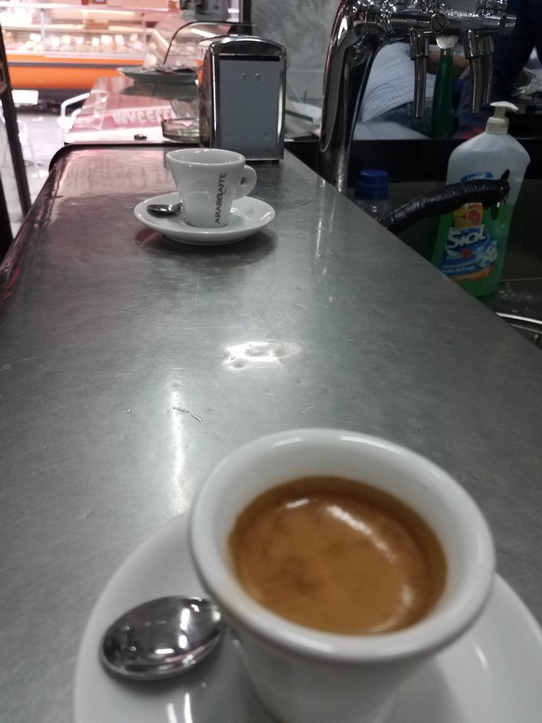 a cup of coffee on a counter