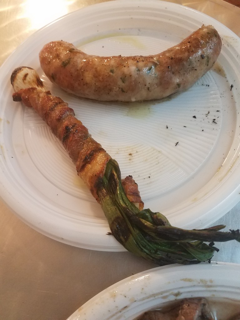 a sausage and a vegetable on a plate