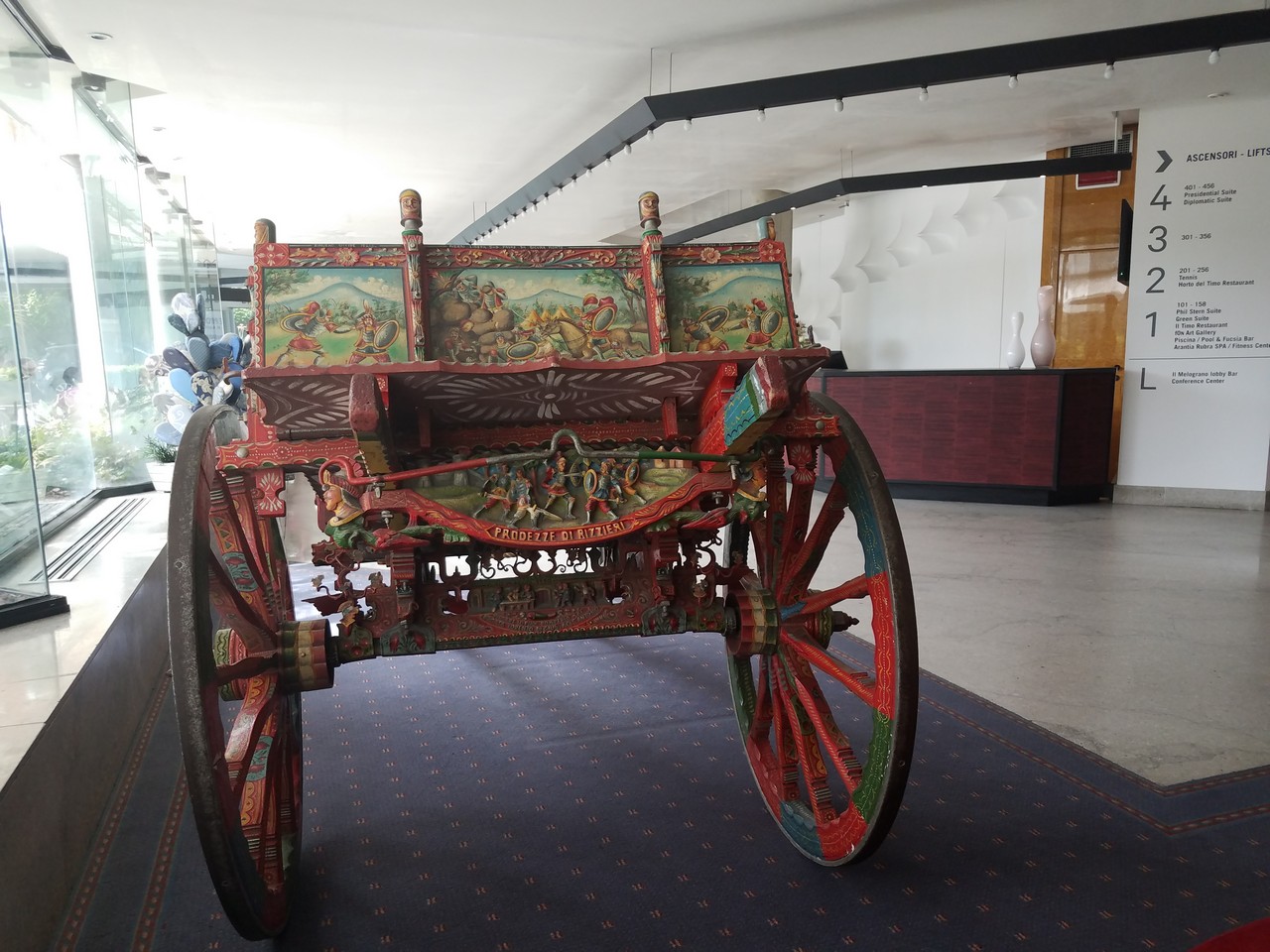 a painted carriage in a room