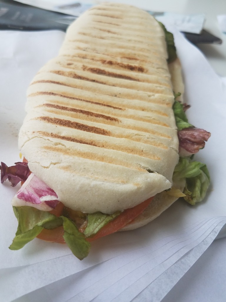 a sandwich on a paper