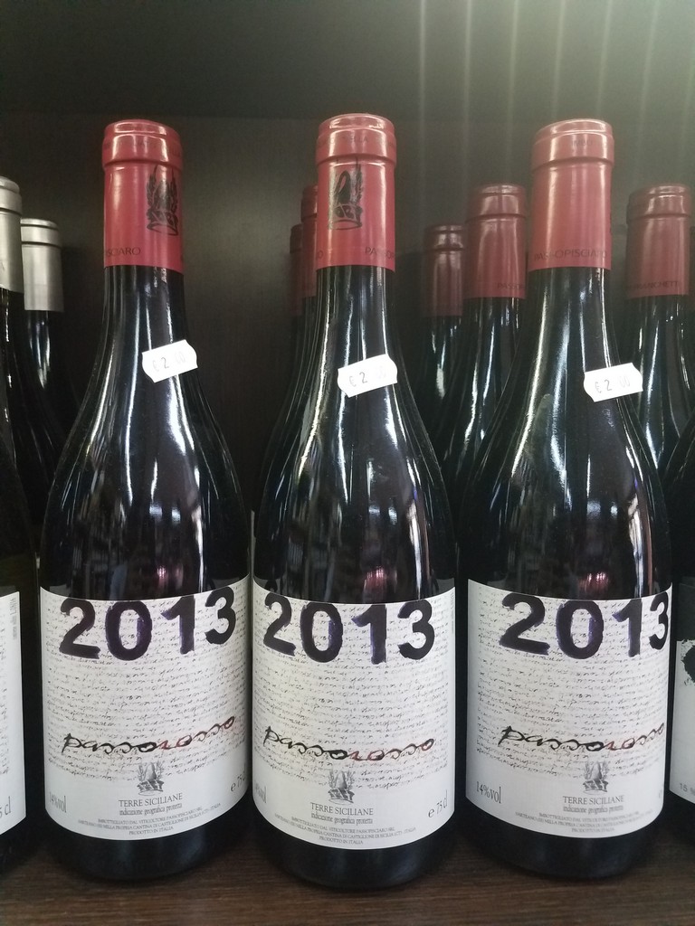 a group of wine bottles with numbers on them