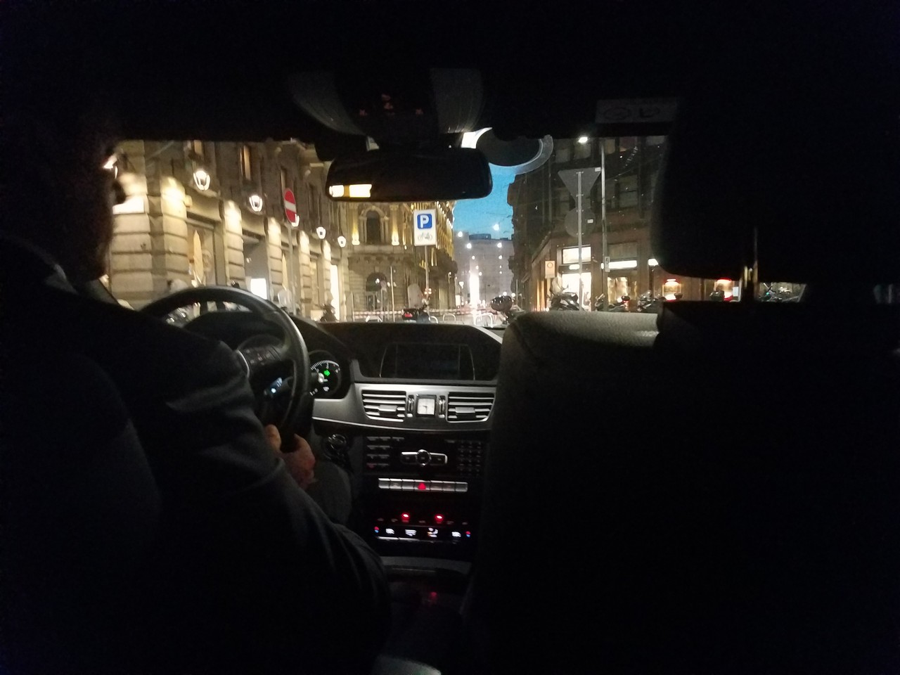 a person driving a car at night