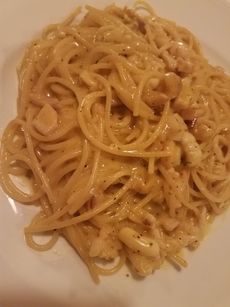 a plate of spaghetti on a white plate