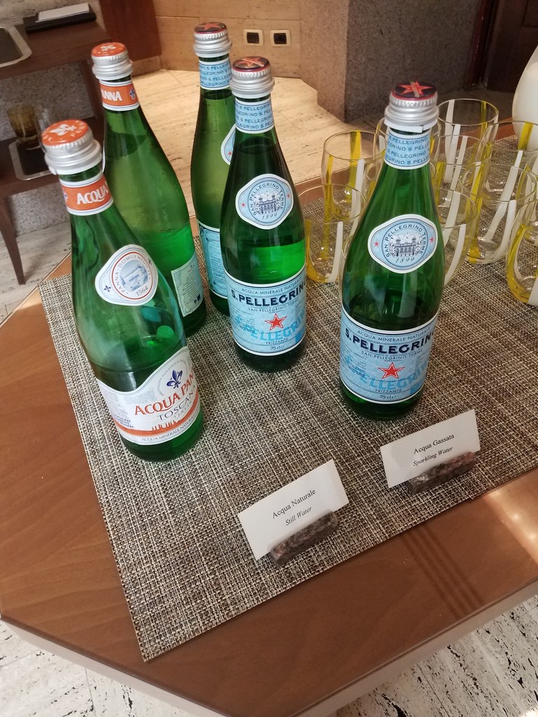 a group of green bottles on a table