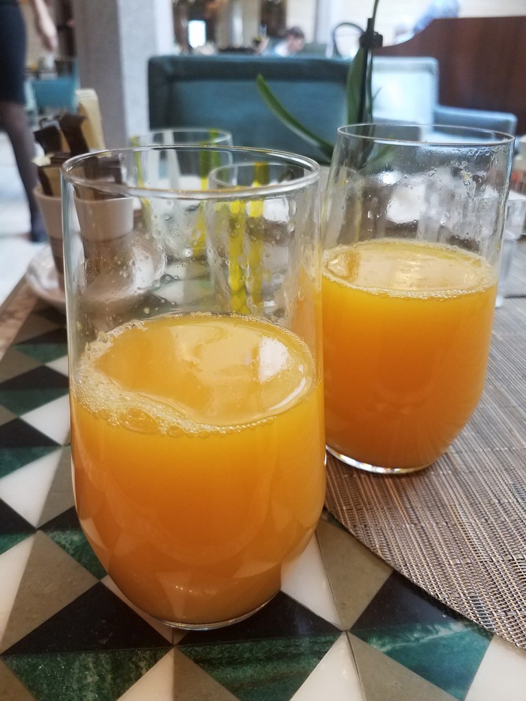 a couple of glasses of orange juice