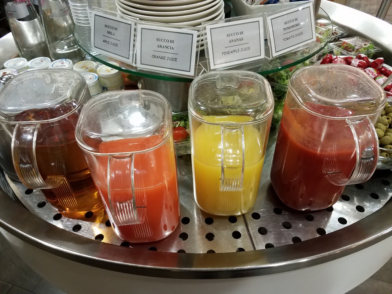a group of juices on a metal tray