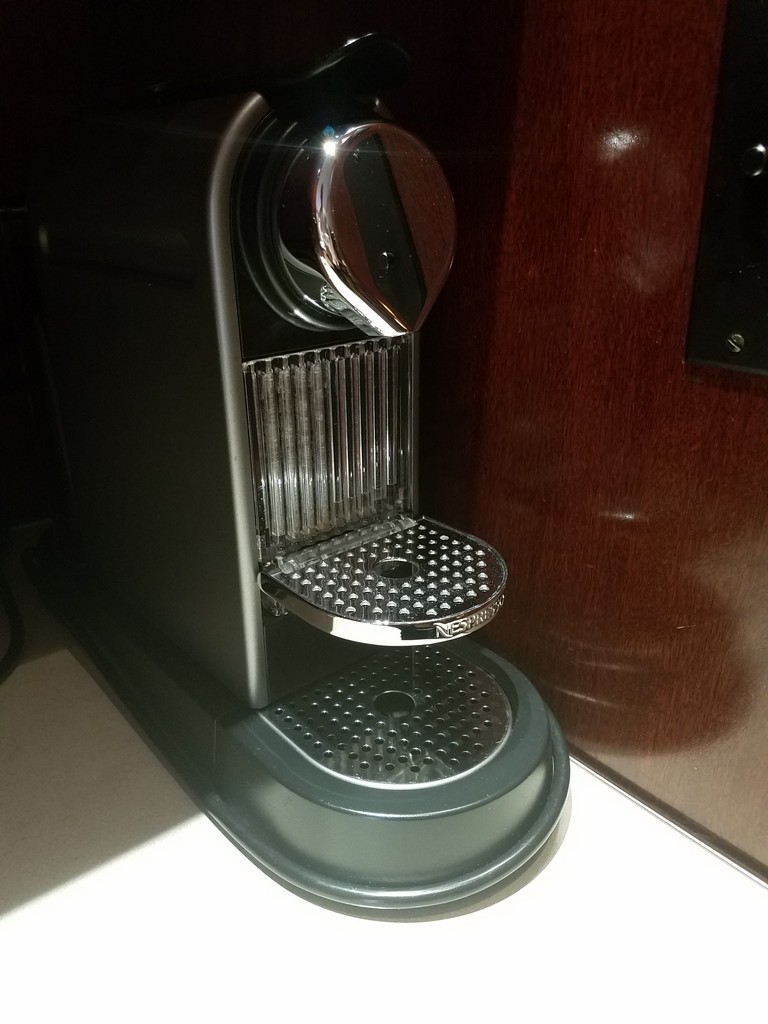 a black and silver coffee machine