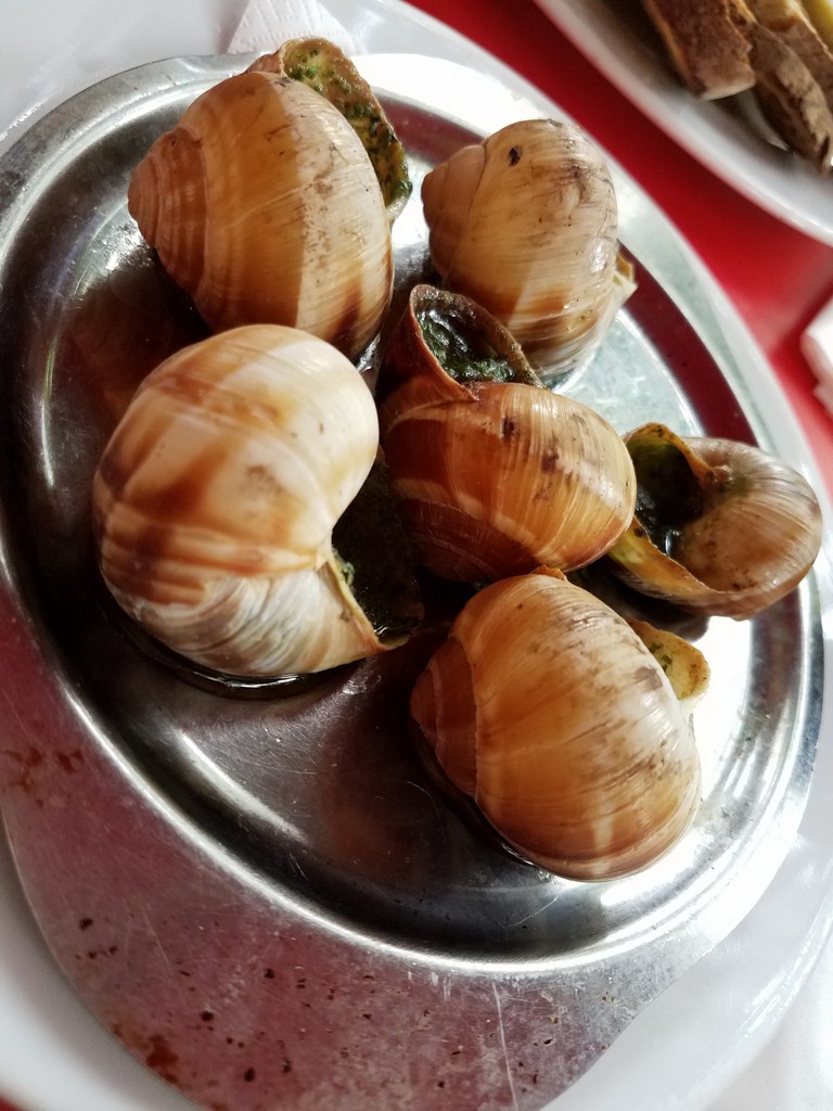 a plate of snails on a table