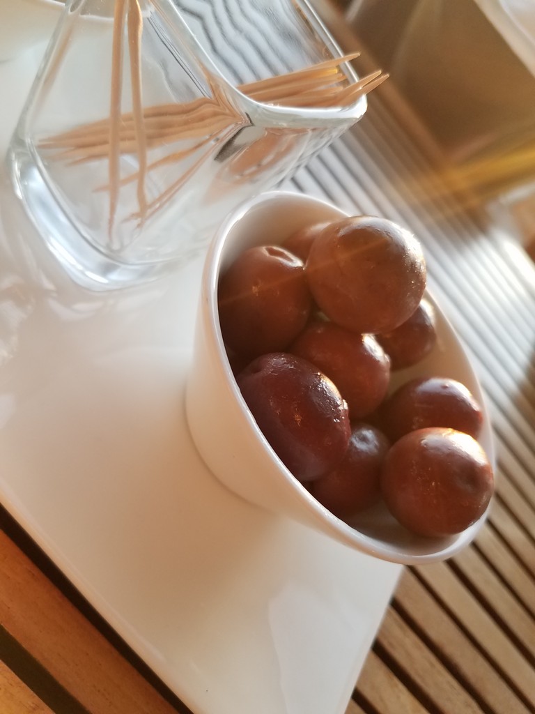 a bowl of brown balls on a white plate
