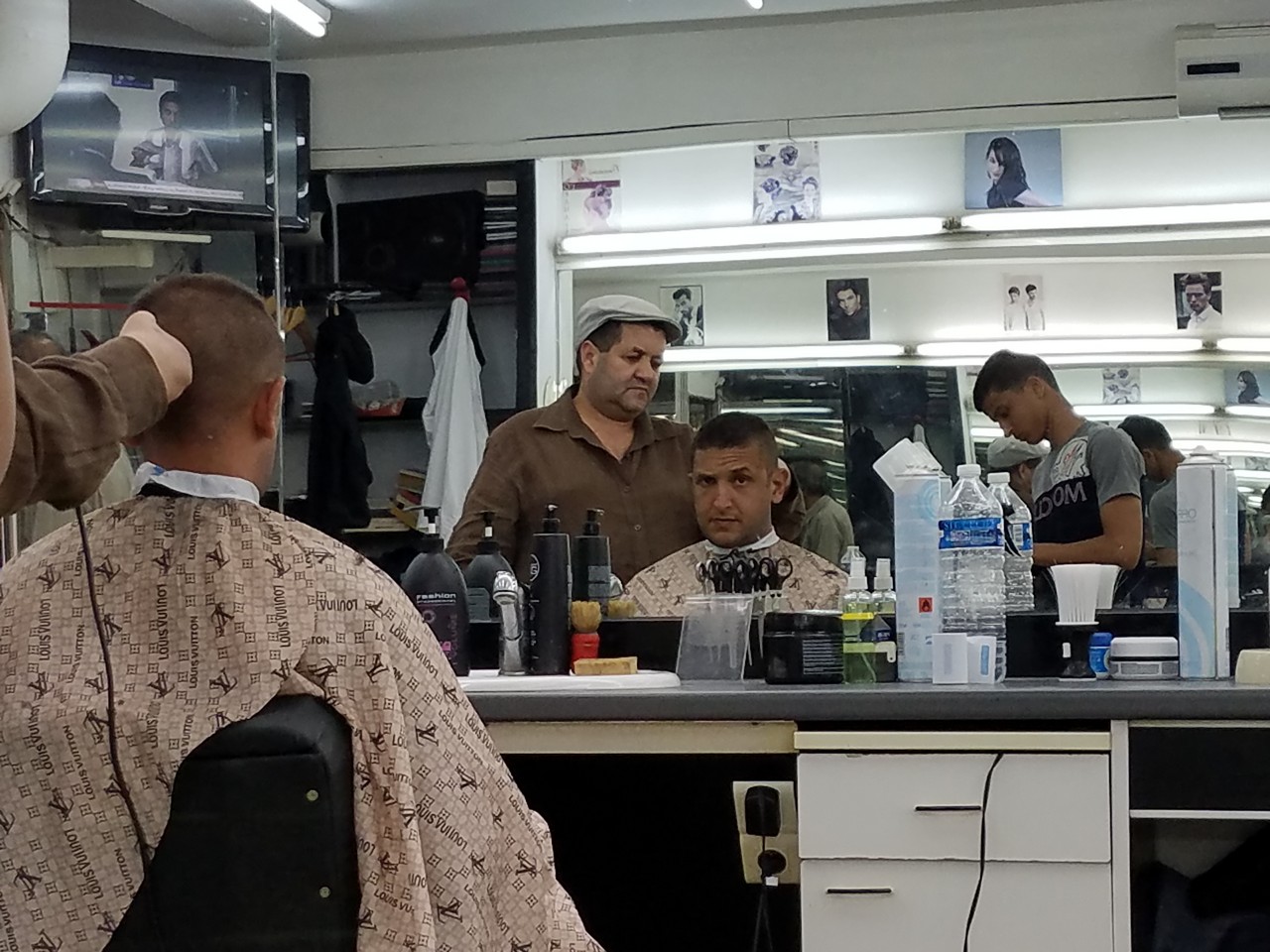 a group of men in a barber shop