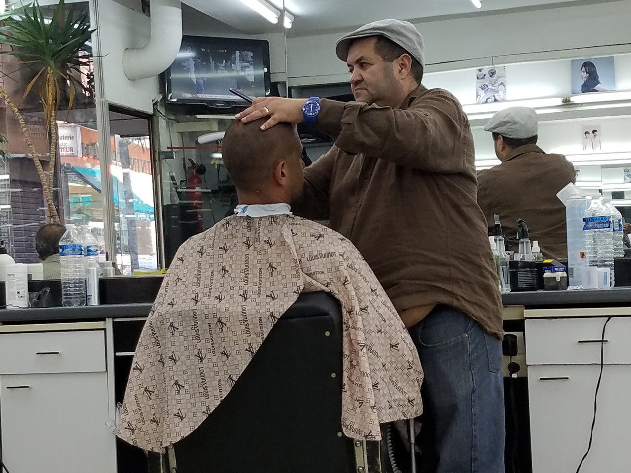 a man cutting a man's hair
