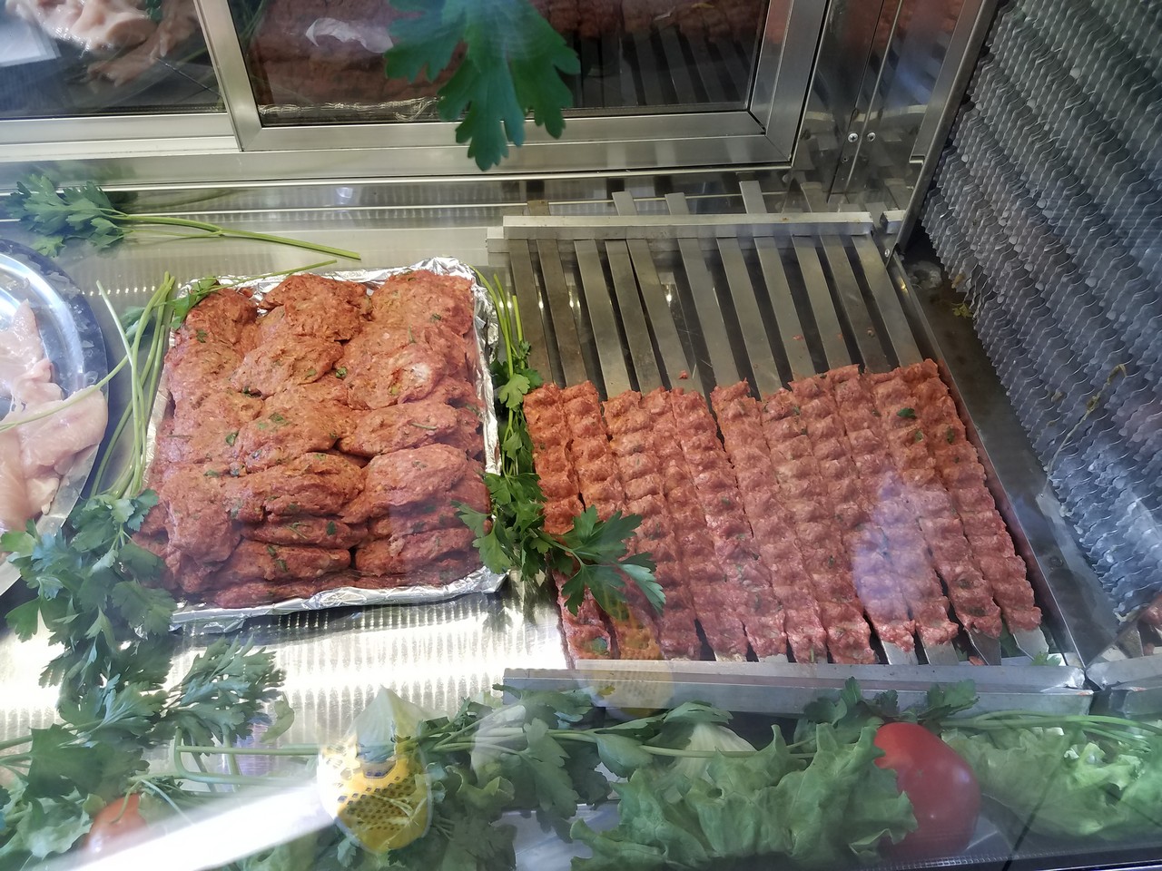a tray of meat and vegetables