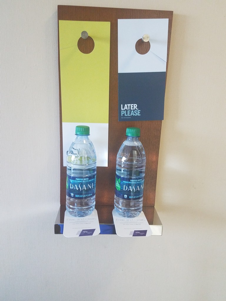 two water bottles on a wall