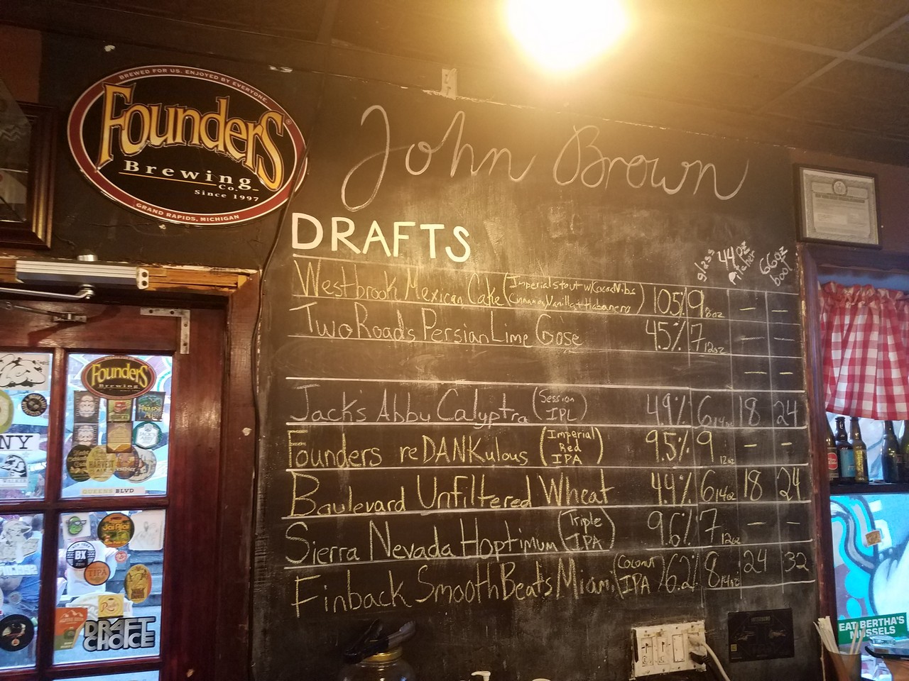a chalkboard with a list of drafts