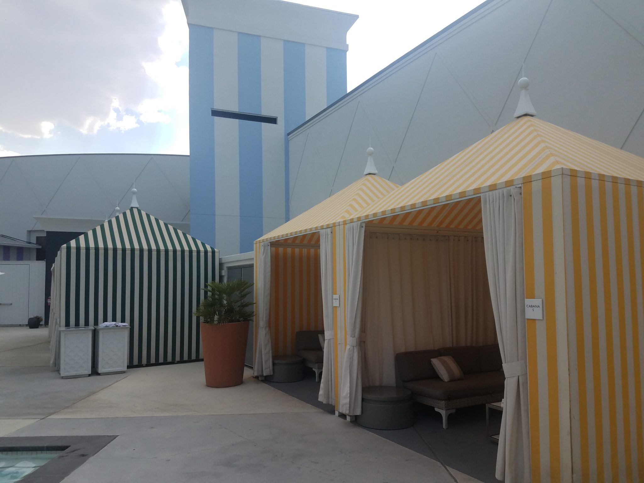 a group of striped tents in a courtyard