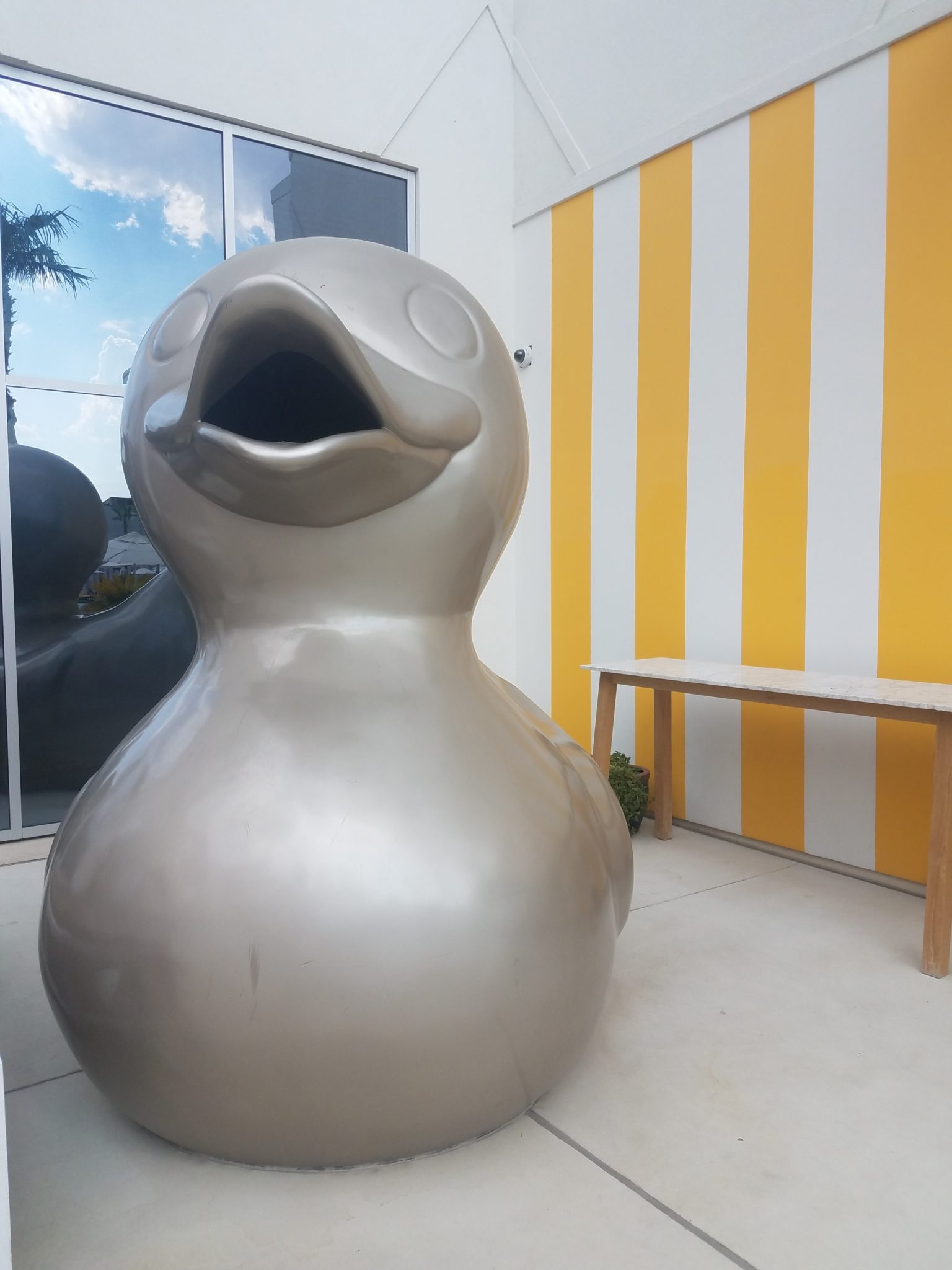 a large grey duck statue