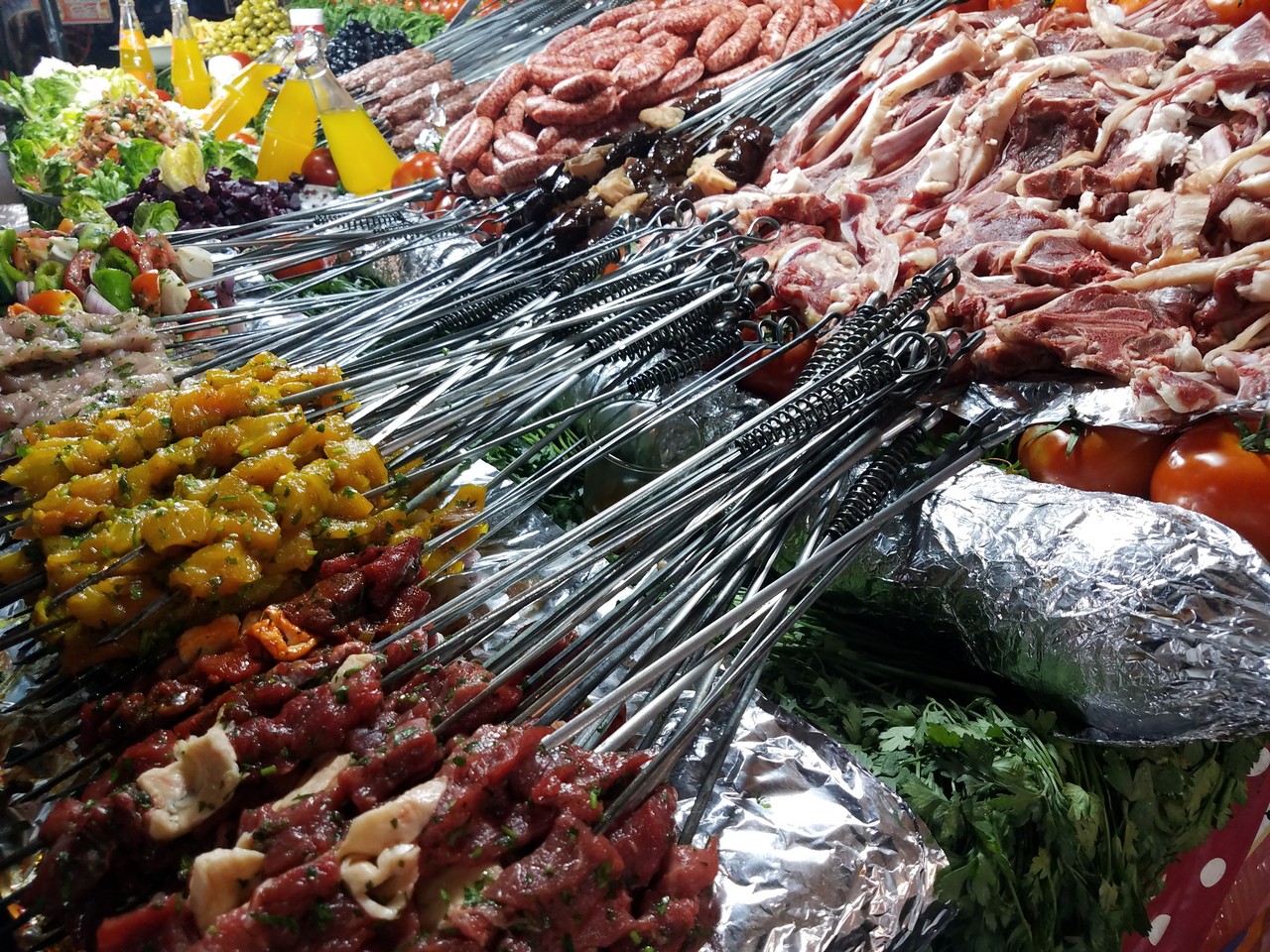 a variety of meat on skewers