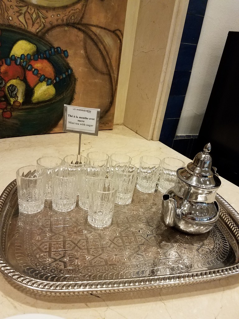 a tray with glasses and a teapot on it