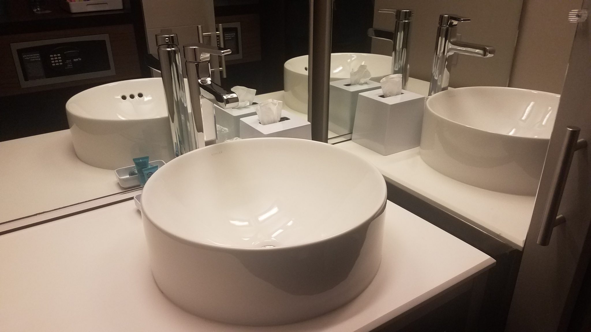 a bathroom sink with a mirror and a few sinks