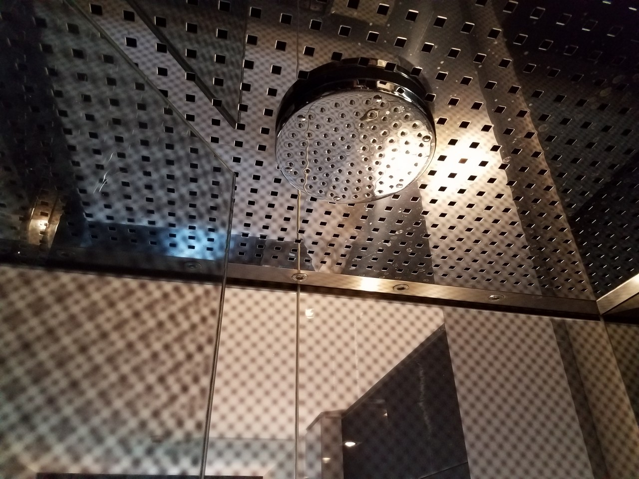 a shower head on a metal surface