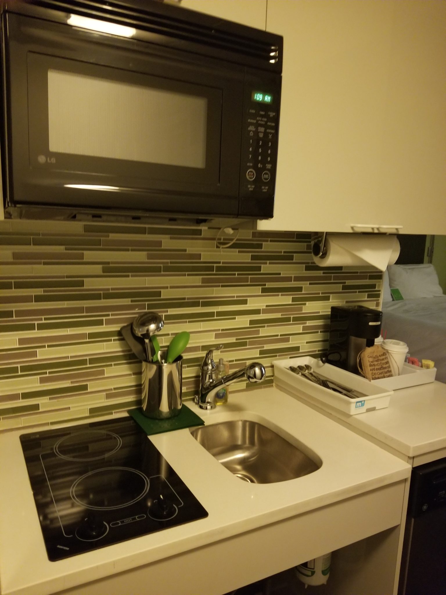 a microwave above a sink