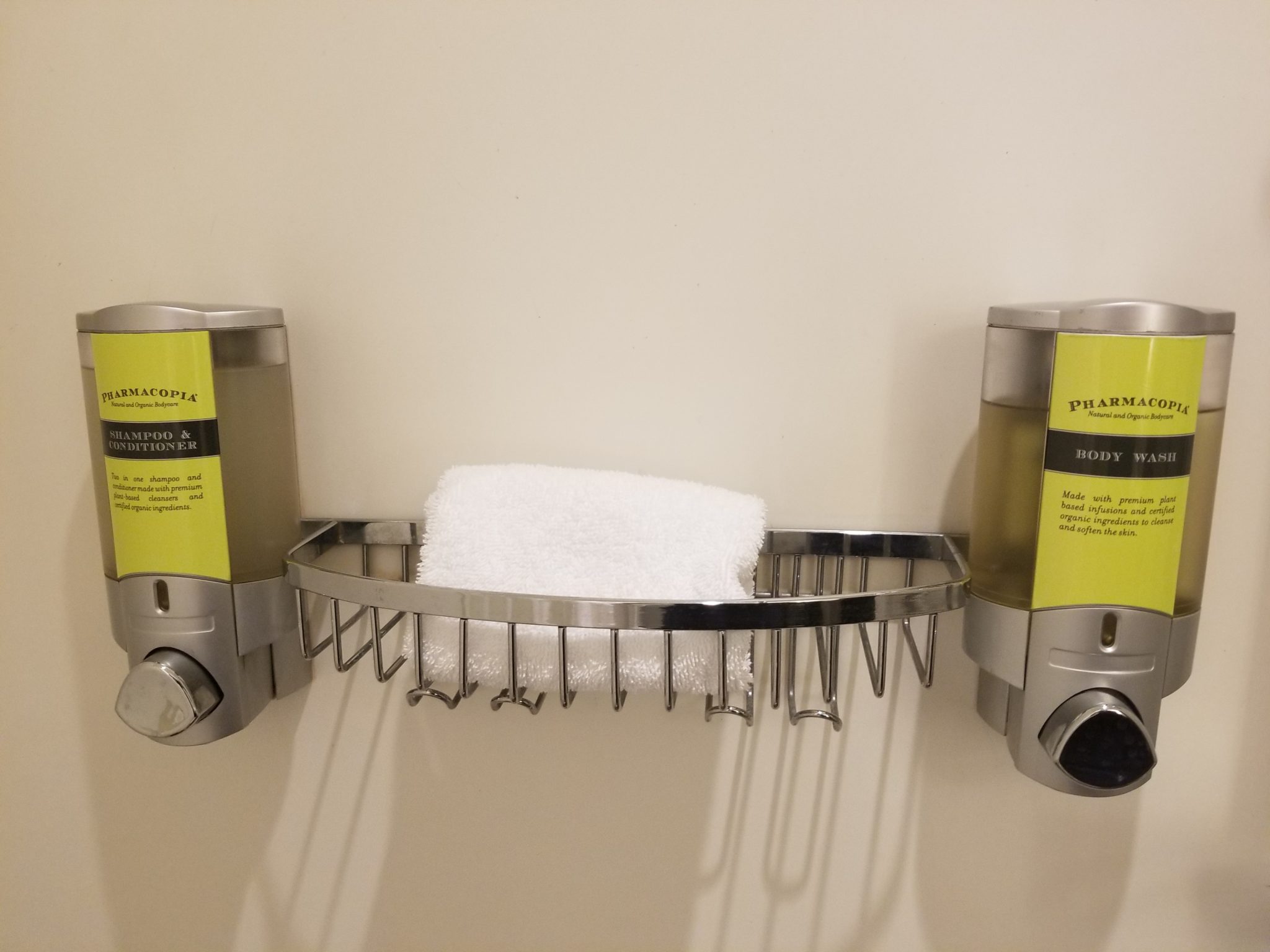 a soap dispenser and a towel rack