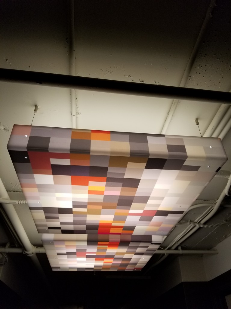 a rectangular light fixture with multiple colored squares