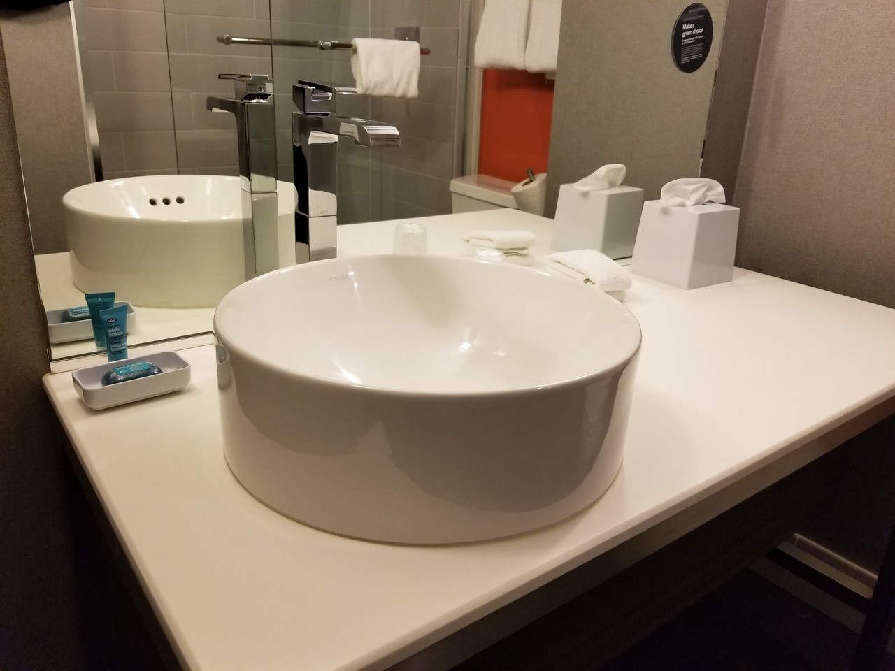 a bathroom sink with a mirror and a faucet