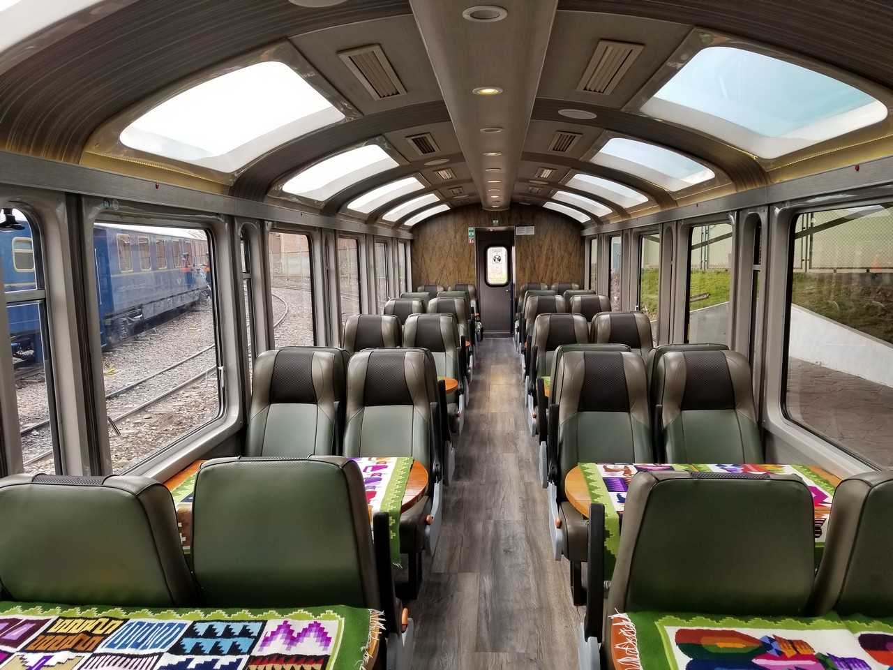 inside a train with seats and tables