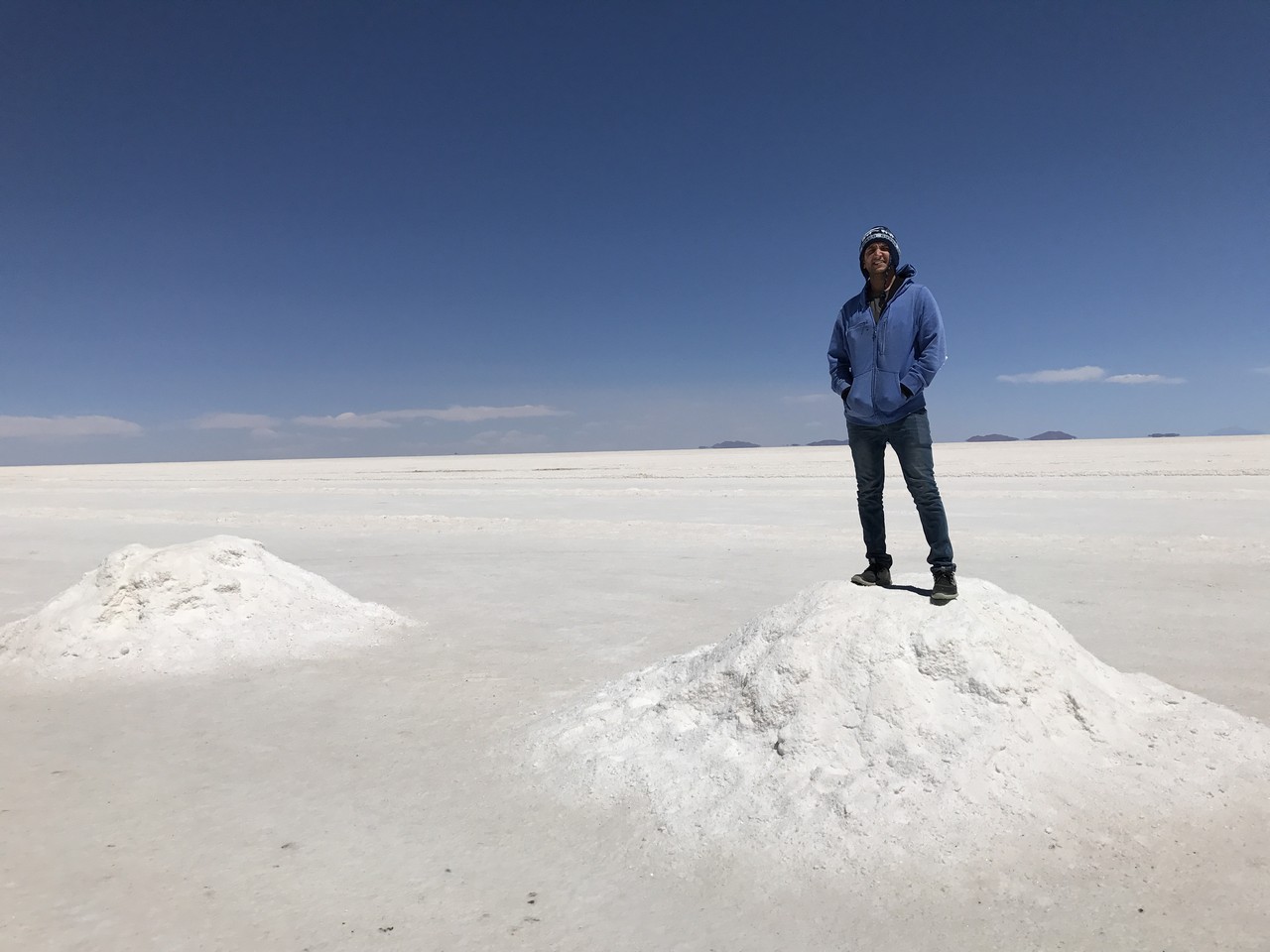 a man standing on a pile of snow