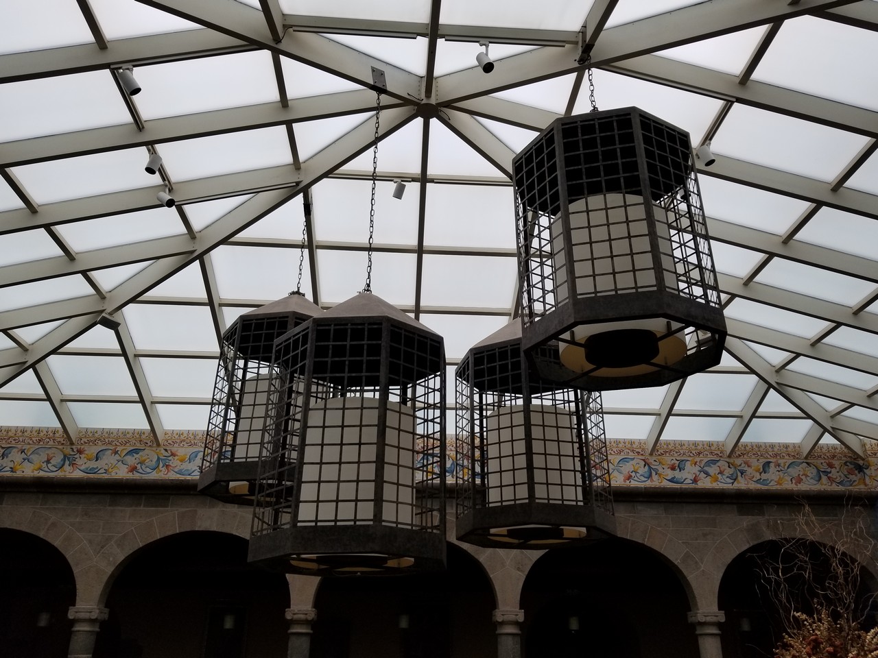 a group of lanterns from a ceiling