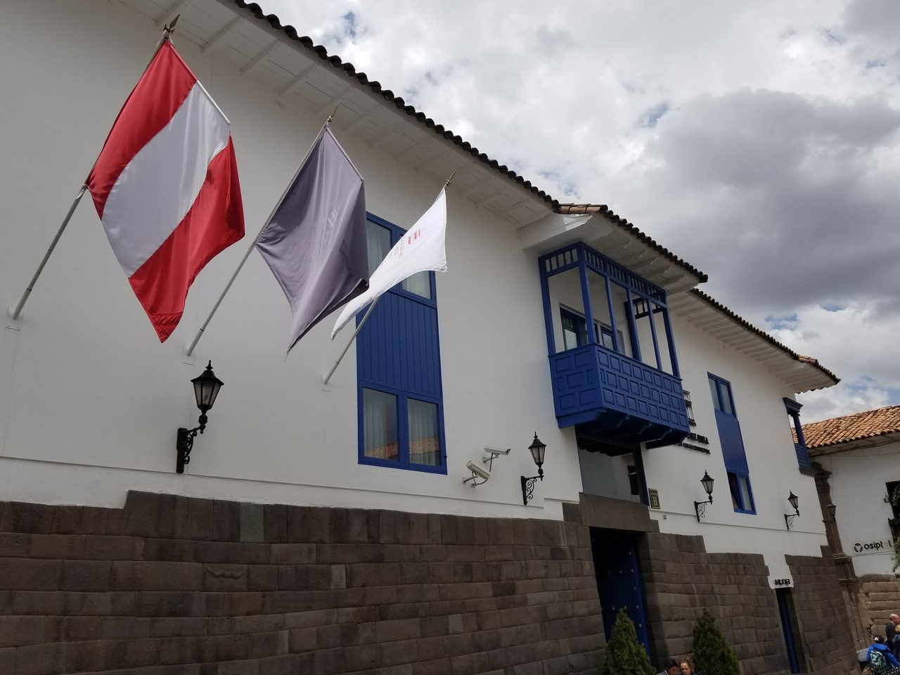 a group of flags on a building