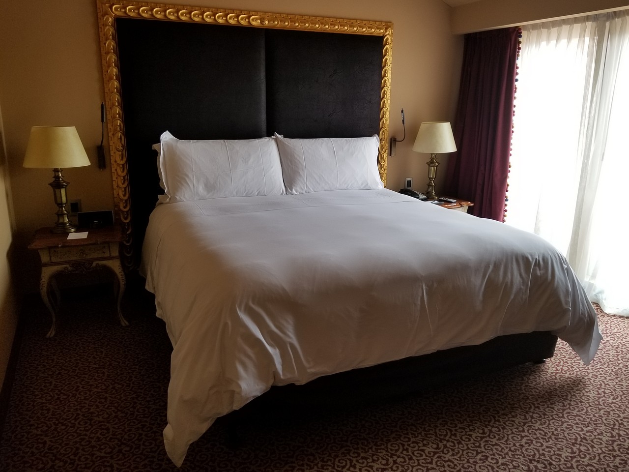 a bed with a gold frame