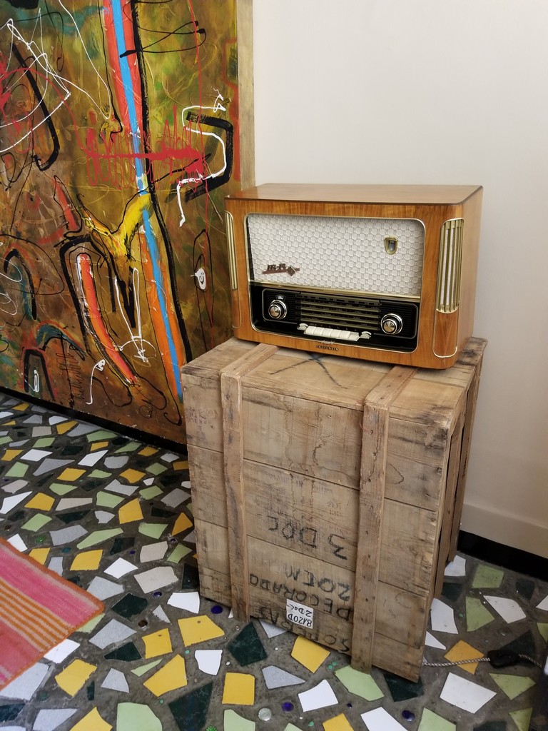 a wooden box with a radio on top
