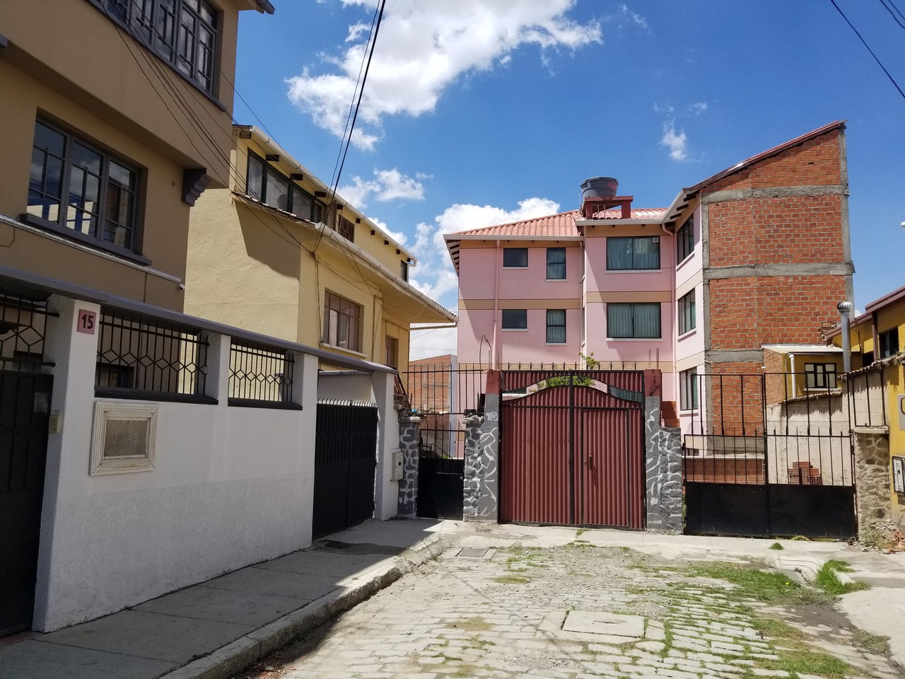 a gated driveway between buildings