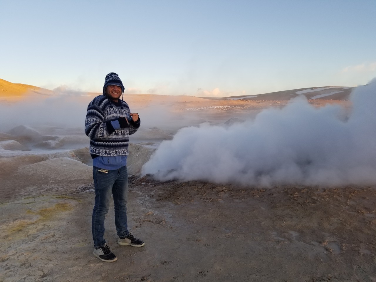 a man standing in front of a steamy area