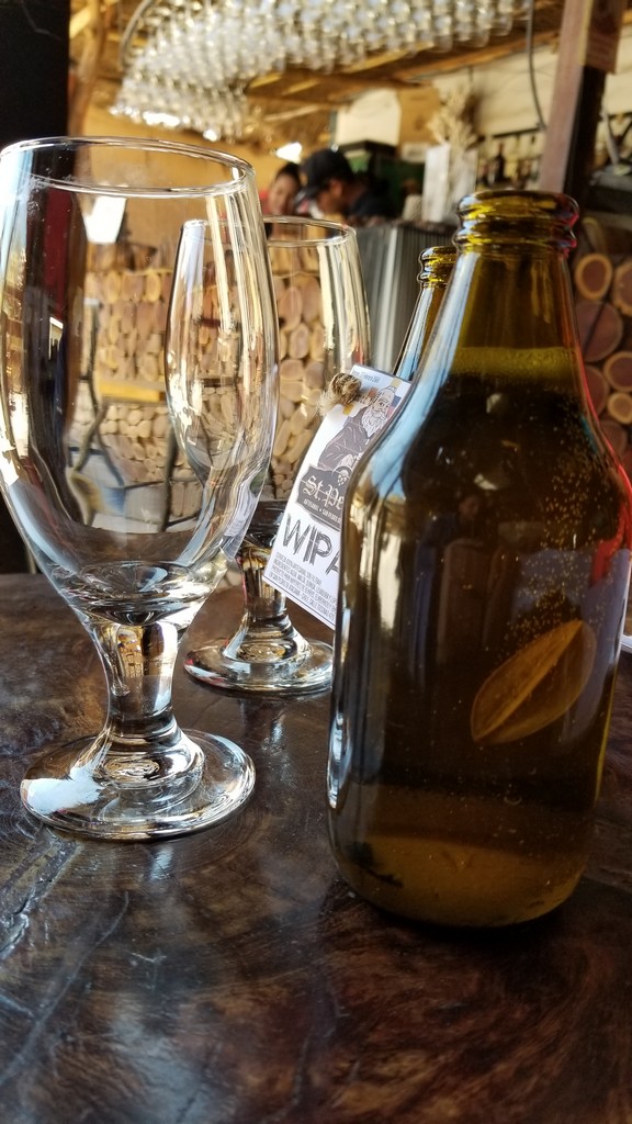 a group of wine glasses and a bottle