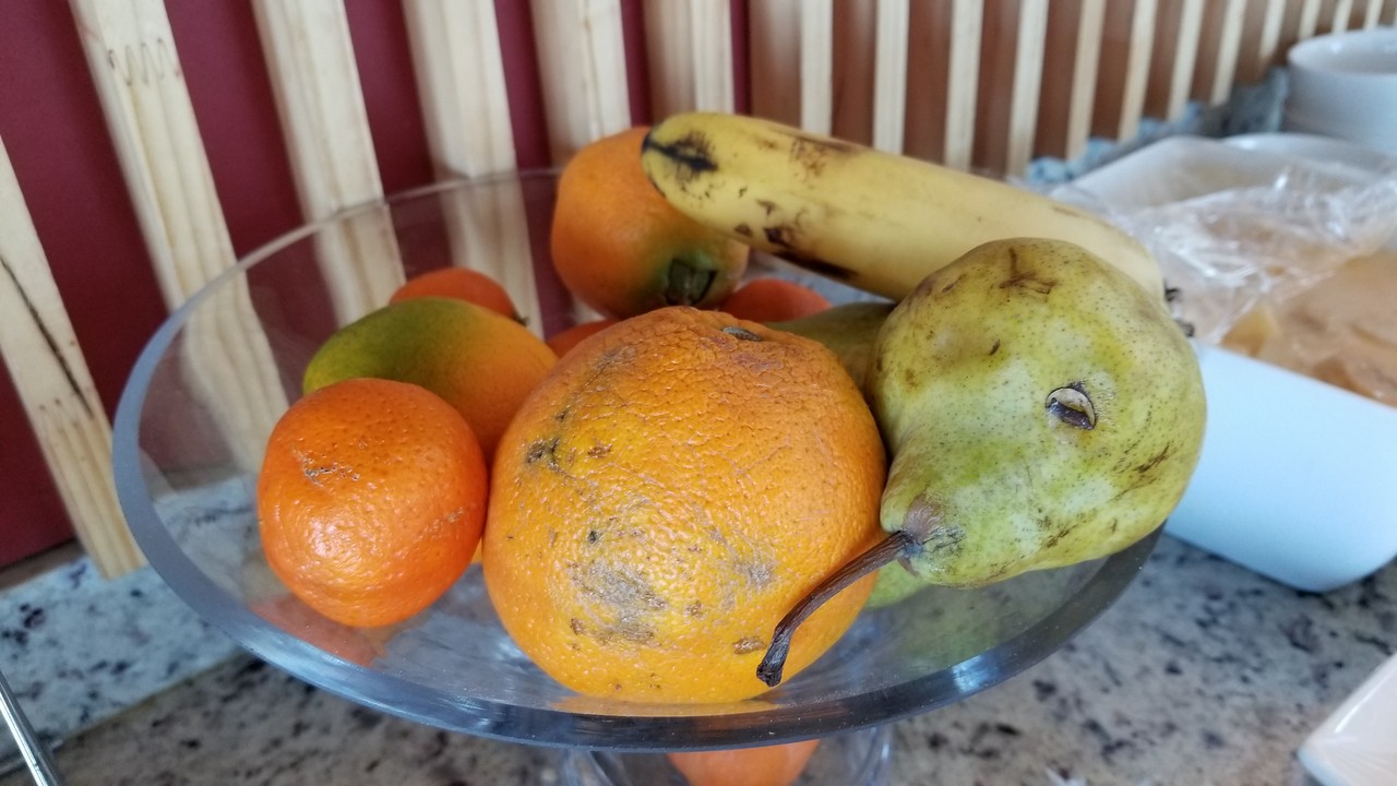a bowl of fruit on a counter