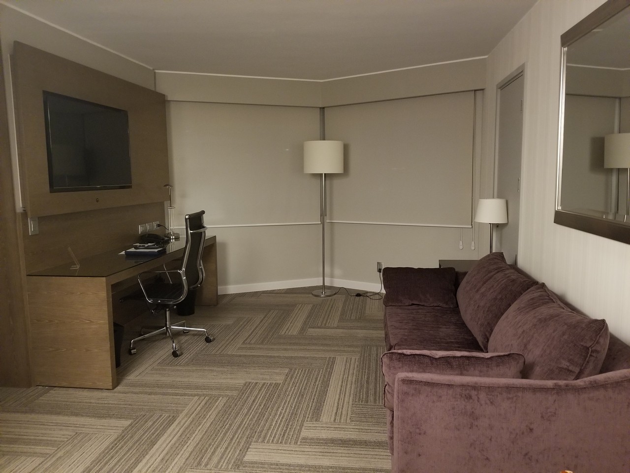a room with a couch and a desk