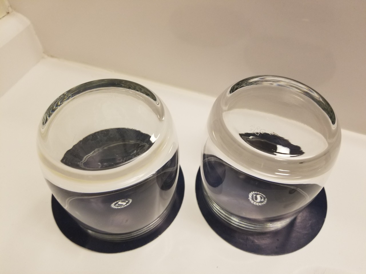 two glass jars on a counter