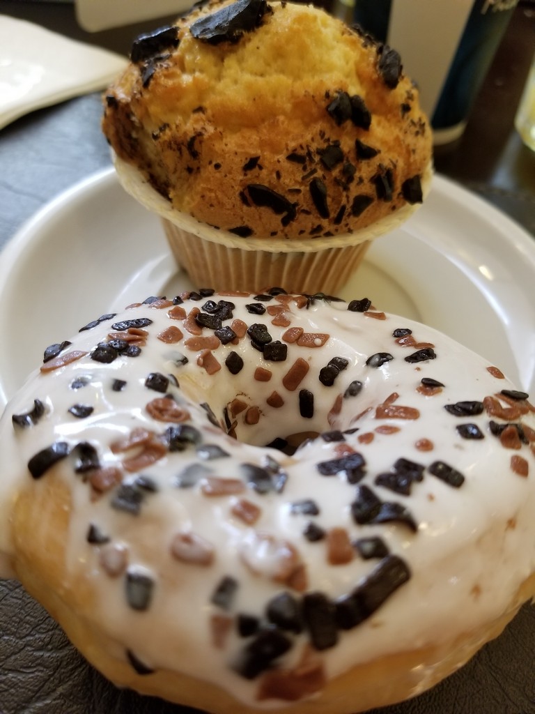 a donut and a muffin on a plate