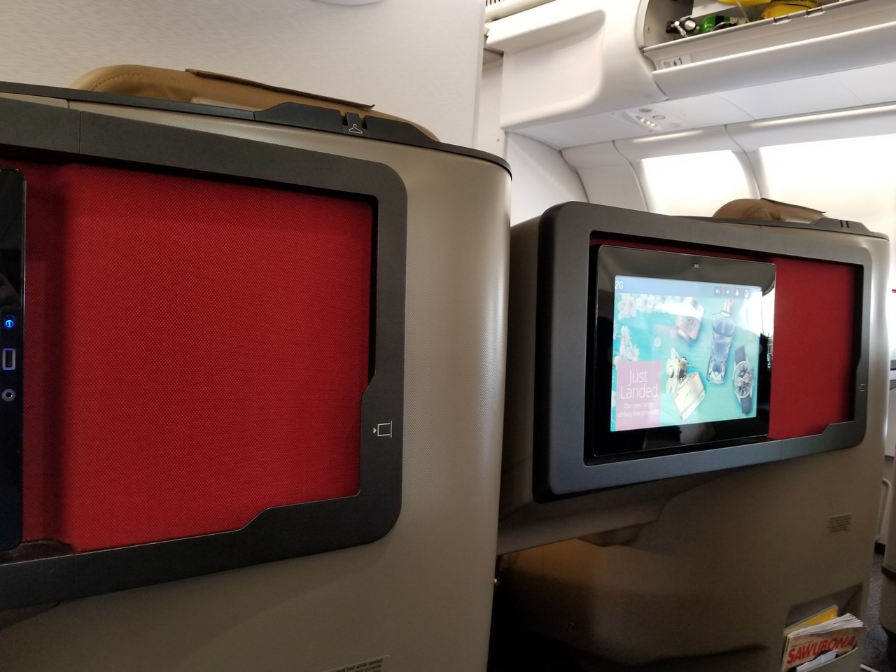 a pair of rectangular screens on an airplane