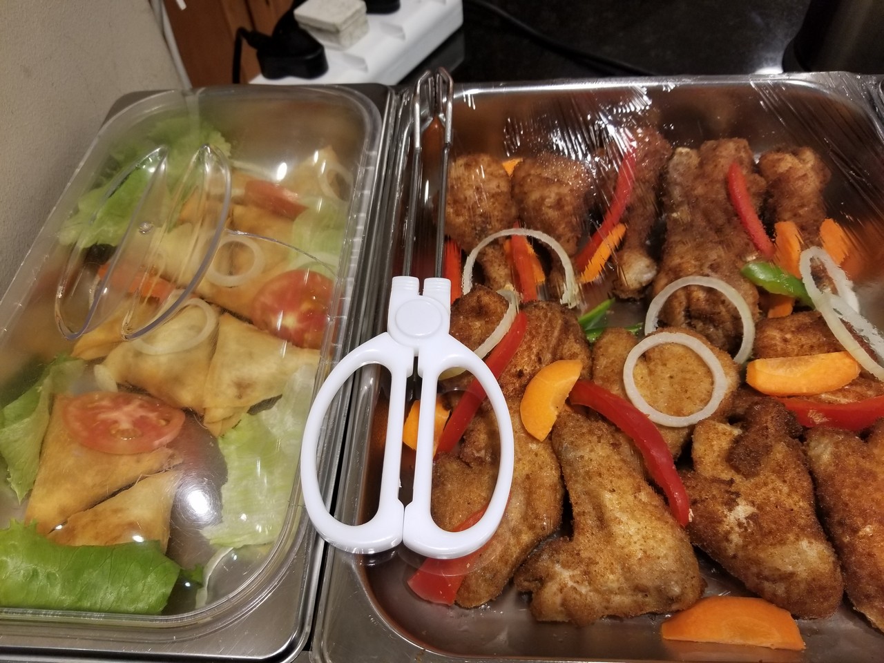 food in a tray with plastic wrap