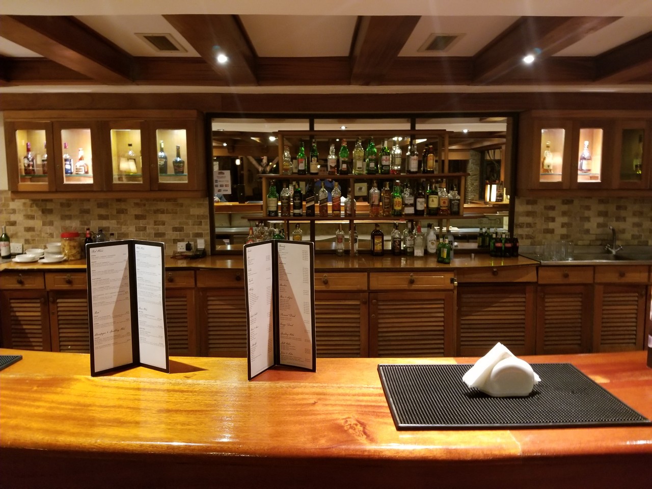 a bar with menus on a counter
