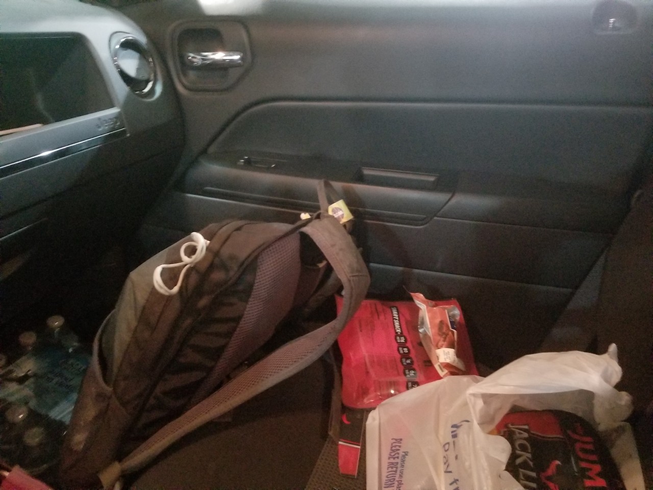 a bag on the floor of a car