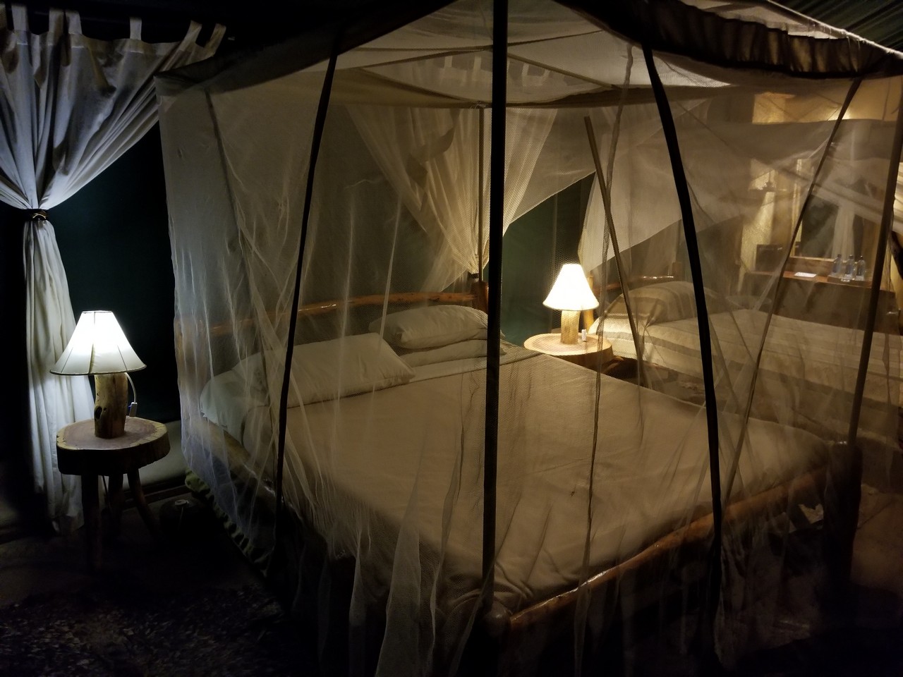 a bed with a mosquito net