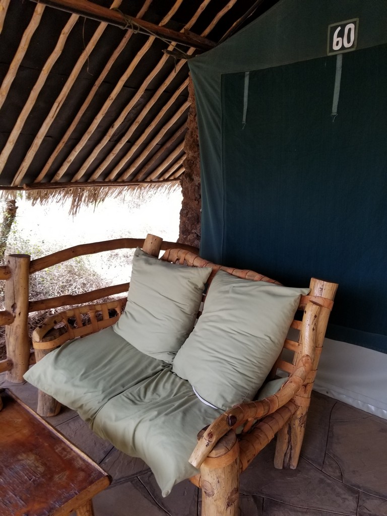 a wooden bench with pillows